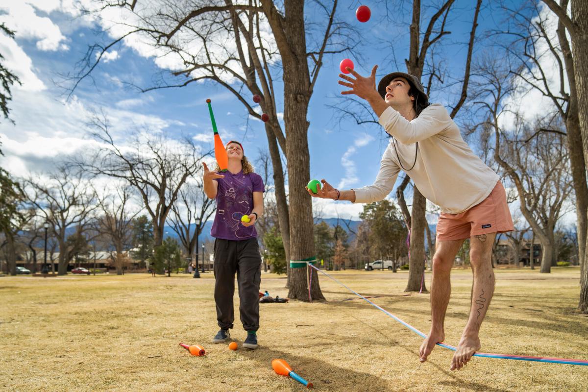 Left, Kieran Blood ’23 and Jack Sawyer ’25 juggle and slackline during a warm winter day in Tava Quad on 3/15/23. Photo by Lonnie Timmons III / Colorado College.